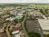 Drone image of Preston Farm showing Falcon Court, a car park, warehouses and other buildings