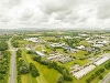 Drone image of Teesside Industrial Estate showing warehouses and green spaces next to a road