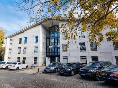 The Belasis Business Centre building with a tree to the left and cars parked at the front