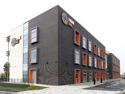 The Fusion Hive building with empty parking spaces in front